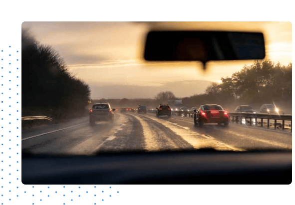 View from dash camera of driving on wet roads