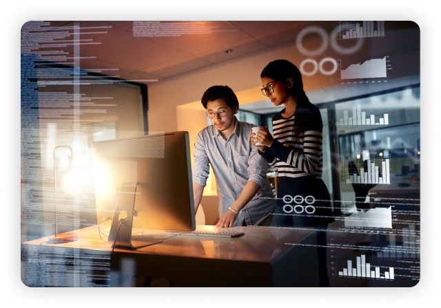 Two people looking at a computer screen